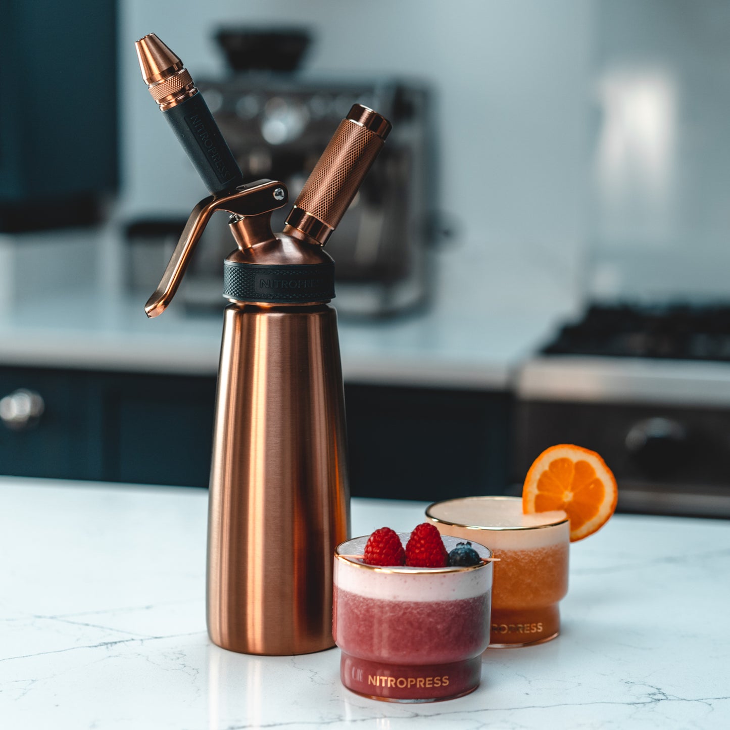 Copper nitropress making nitro orange and raspberry drinks for kids